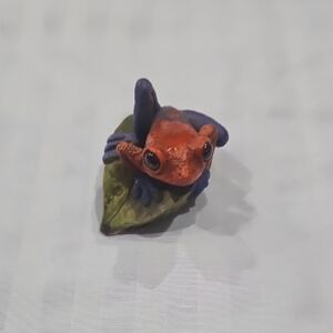 Colorful Frog Figurine on Leaf